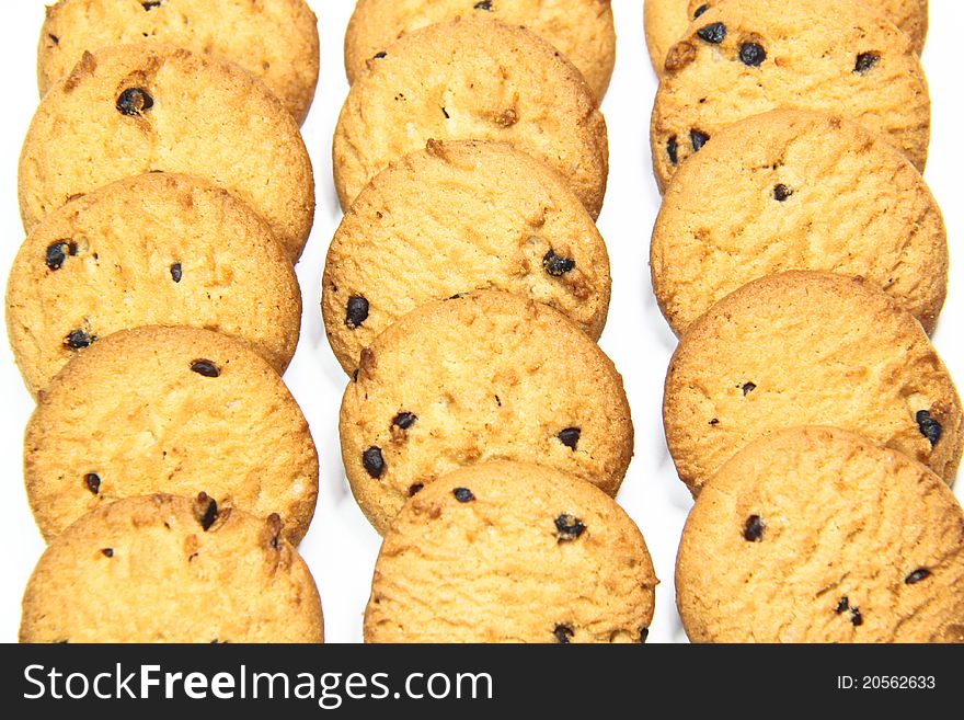 Close up of three piles of chocolate chip cookies