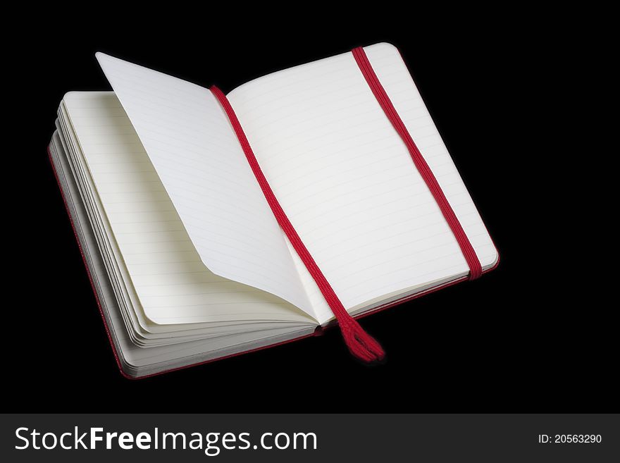 Open notebook with a red tab with space for text. Open notebook with a red tab with space for text