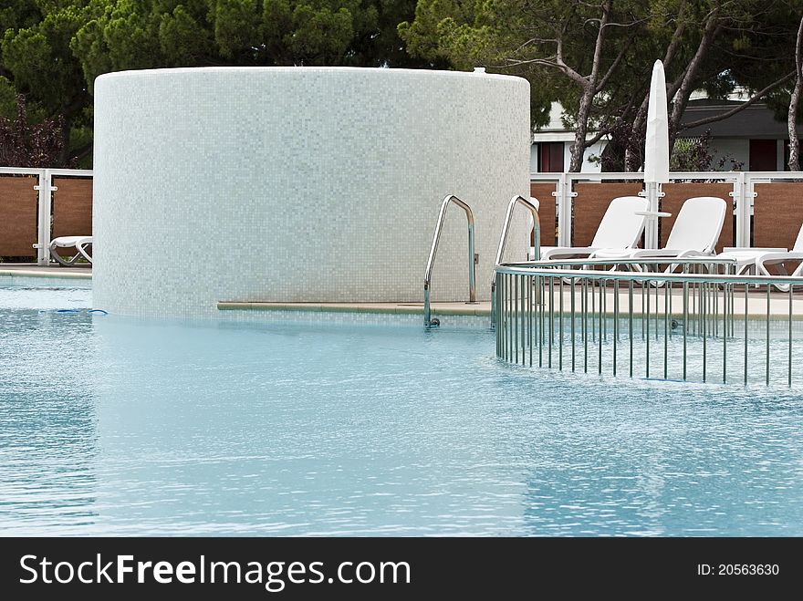 An outdoor swimming-pool with thermal water to realx while being at the spa. An outdoor swimming-pool with thermal water to realx while being at the spa
