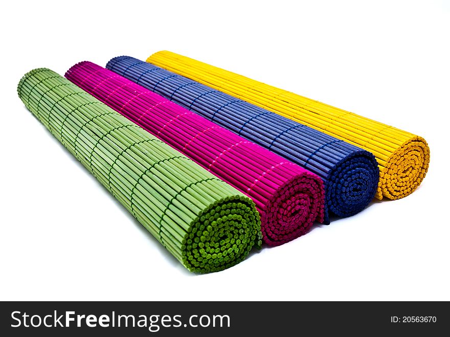 Green, pink, blue and yellow place mats group isolated over white background. Green, pink, blue and yellow place mats group isolated over white background.