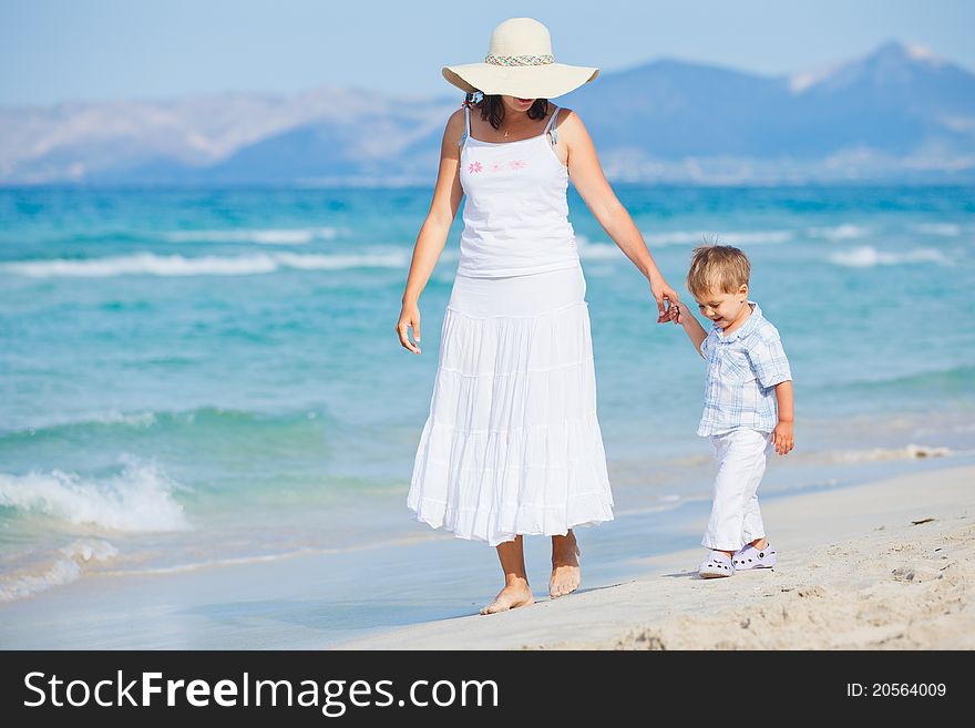 Young mother with her son on tropical beach vacation. Young mother with her son on tropical beach vacation