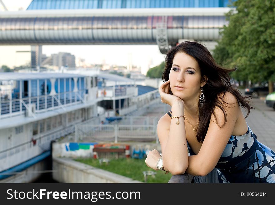 Girl walking outdoor on embankment