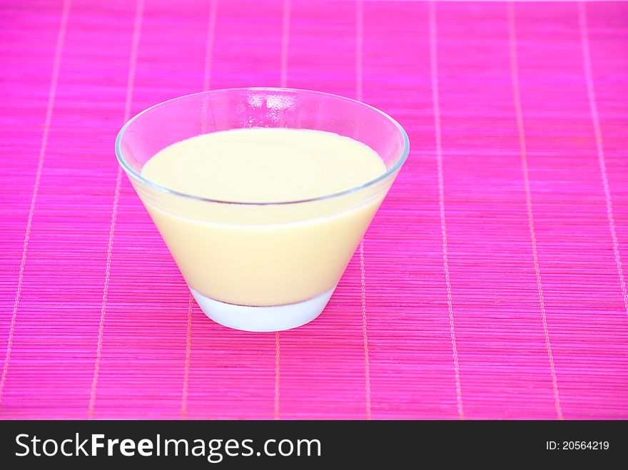 Papaya mousse over pink napkin.