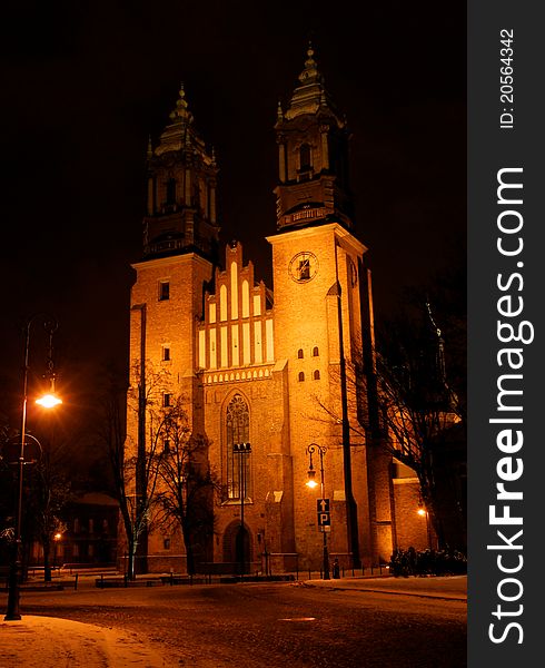 Towers of cathedral church at night in Poznan