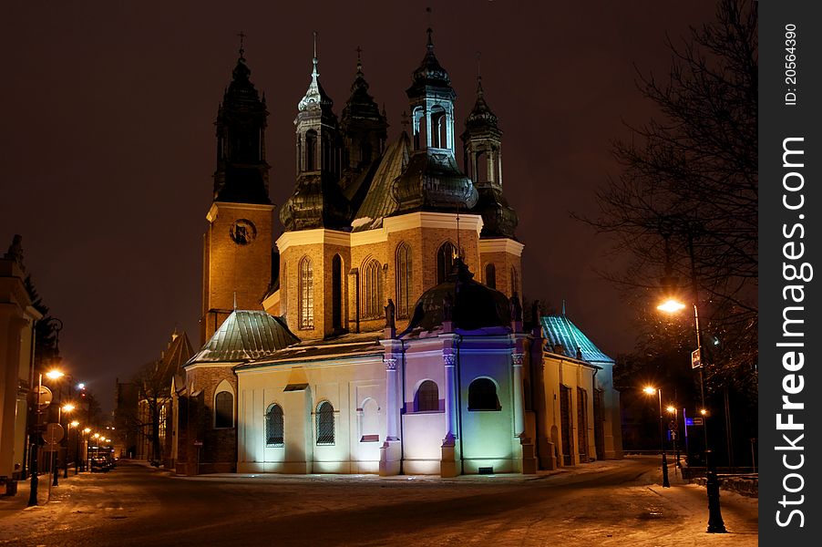 Towers of cathedral church at night in Poznan