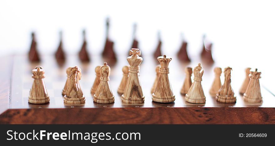 Wooden chess stand on the board