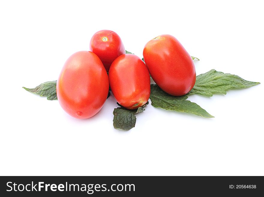 Fresh tomatoes on a white background close-up isolated
