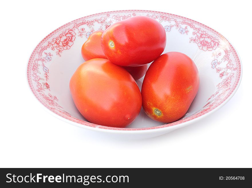 Fresh tomatoes tomatoes in bowl  on a white background close-up