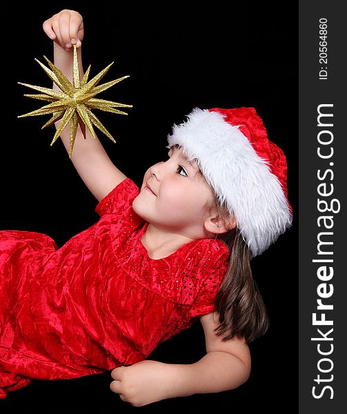 Little Girl Playing With Christmas Ornament