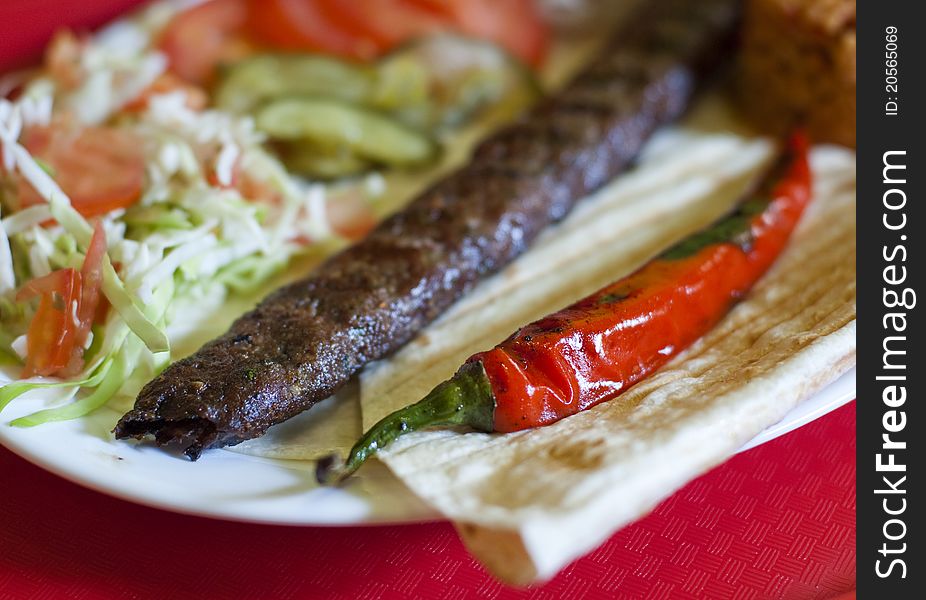 Traditional turkish Adana kebab served with rice, vegetables and lavash. Traditional turkish Adana kebab served with rice, vegetables and lavash