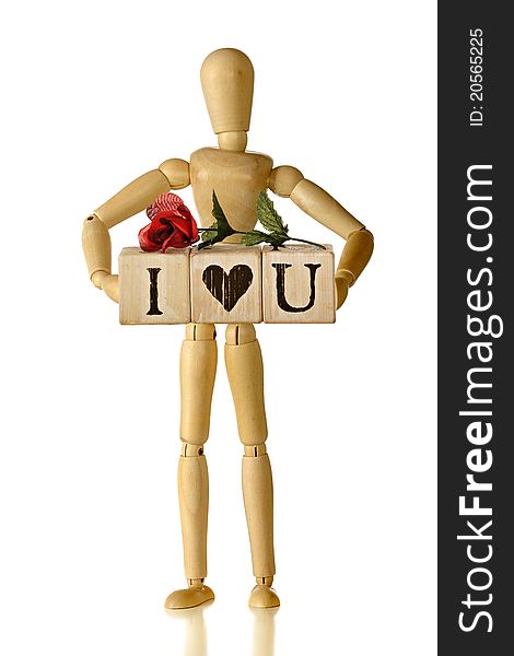 A wooden artist's dummy carrying rustic alphabet blocks that spell out I love you (symbolically), topped with a red rose. Isolated on white. A wooden artist's dummy carrying rustic alphabet blocks that spell out I love you (symbolically), topped with a red rose. Isolated on white.