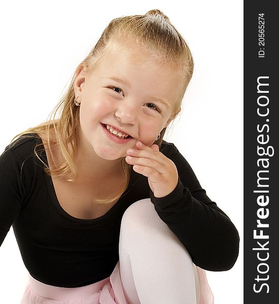 Closeup image of an adorable 3-year-old dressed in her ballerina outfit. Isolated on white. Closeup image of an adorable 3-year-old dressed in her ballerina outfit. Isolated on white.