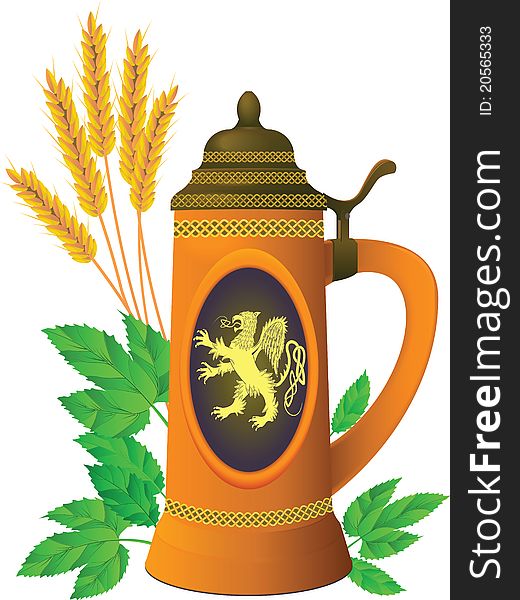 Beer mug on a background of leaves of hop and ears of barley in a