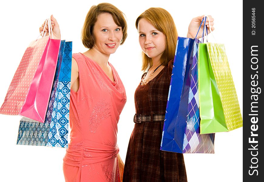 Girls with shopping on white background.