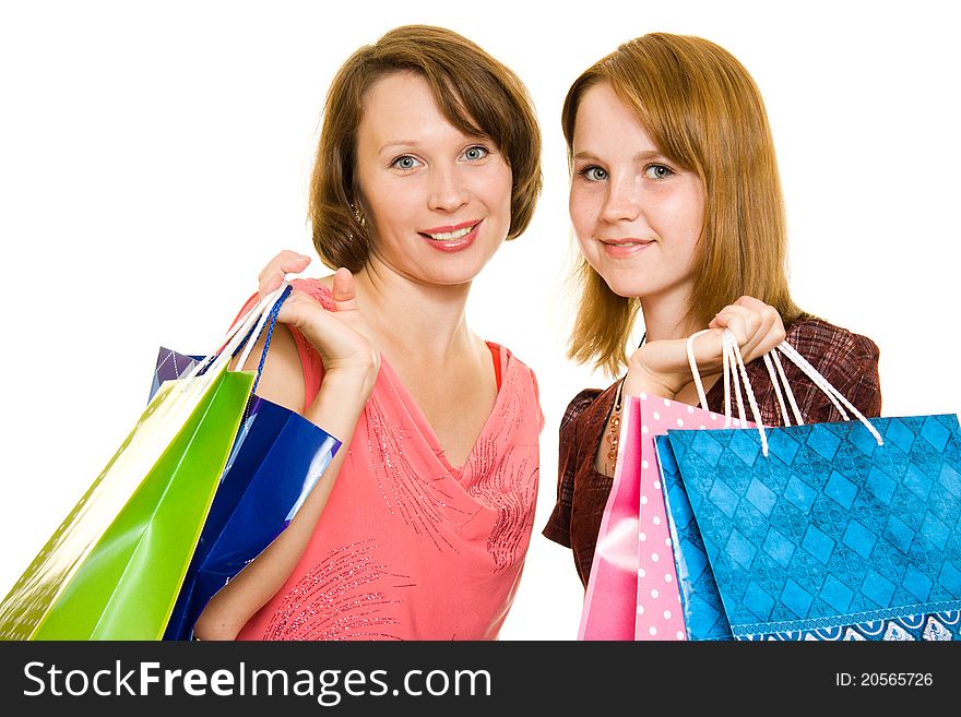 Girls with shopping on white background.