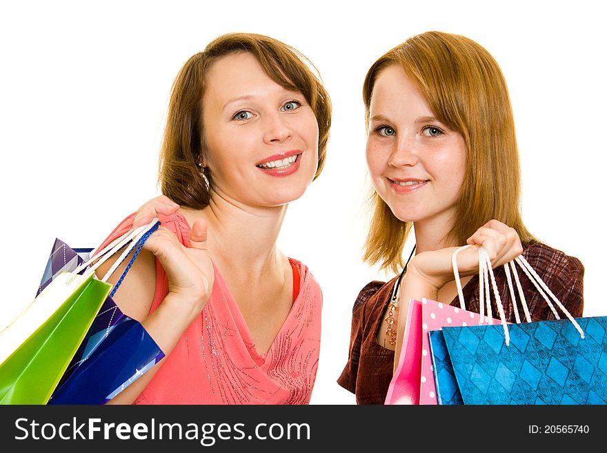 Girls with shopping on white background.