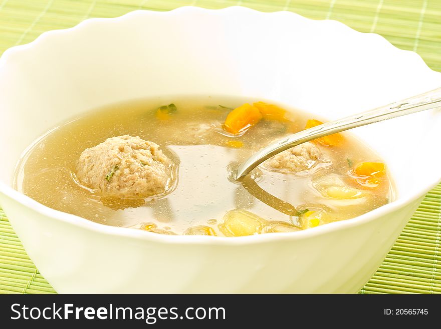 Vegetable soup with meatballs in a plate
