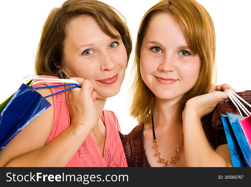 Girls with shopping on white background.