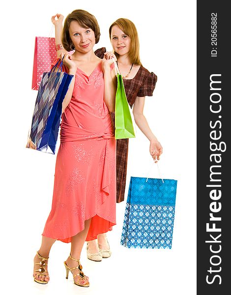 Girls with shopping on white background.