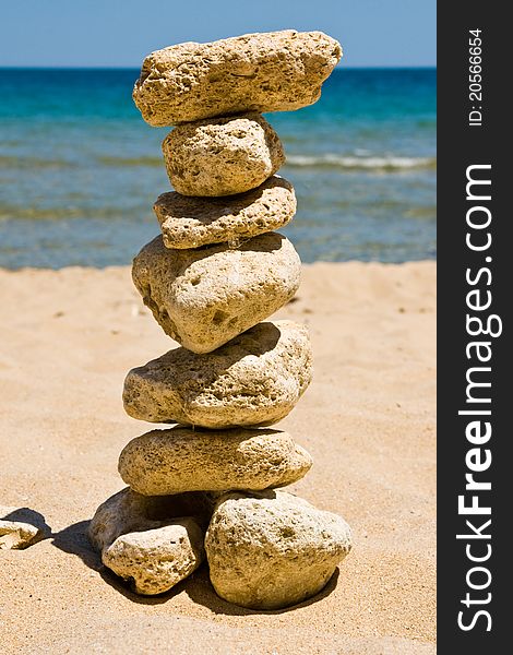 Stack of pebble stones on sea beach