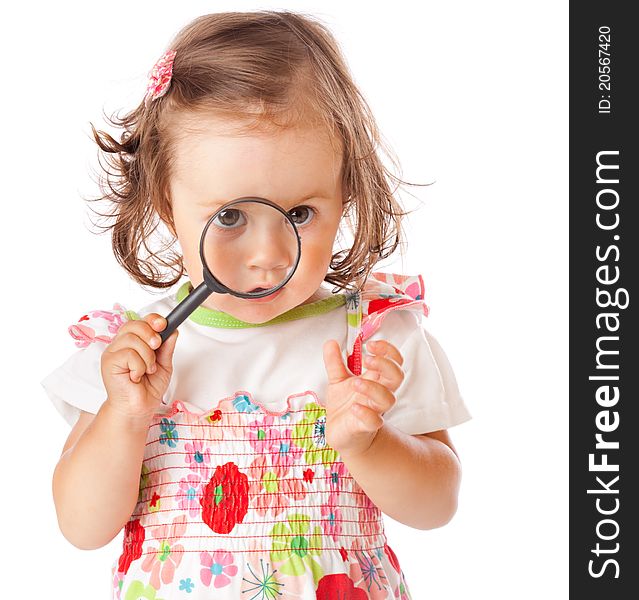 A Little Girl Is Looking Through The Loupe