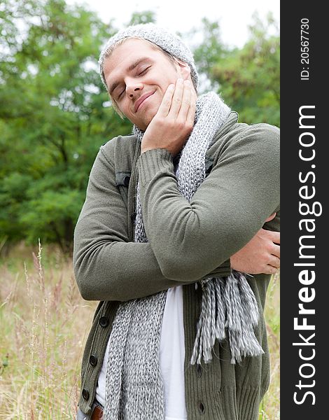 Man relaxing in nature with scarf