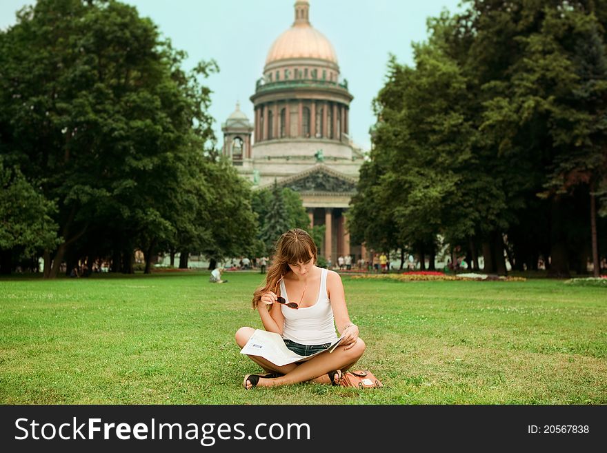 Portrait Of Happy Young Tourist Girl With The Map