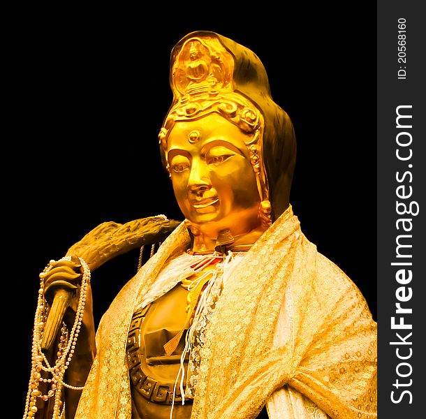 Guanyin bodhisattva image in a temple at Ratchaburi ,Thailand with black background. Guanyin bodhisattva image in a temple at Ratchaburi ,Thailand with black background