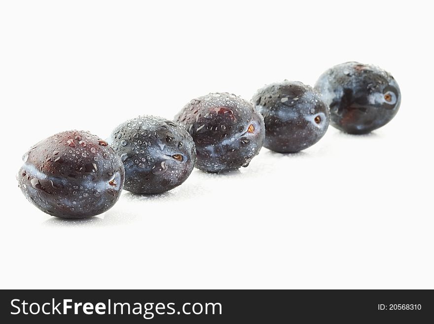 Plums on a white background