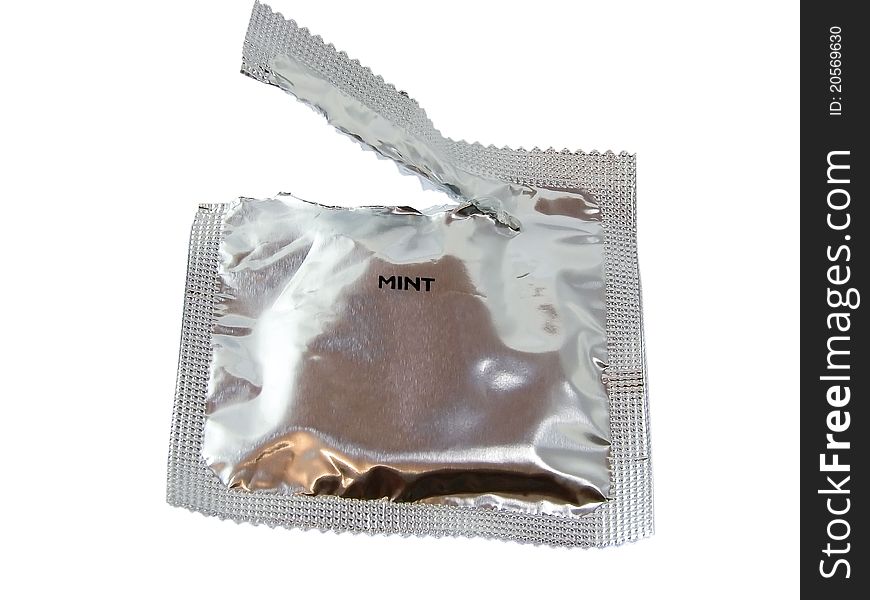 Open pack of condom isolated on white background