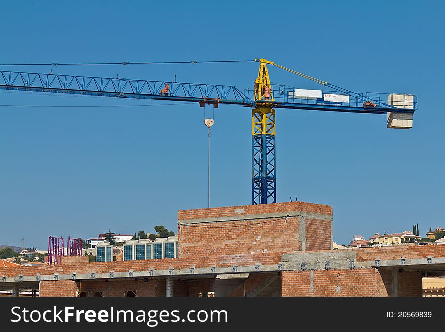 Building under construction and tower crane. Building under construction and tower crane