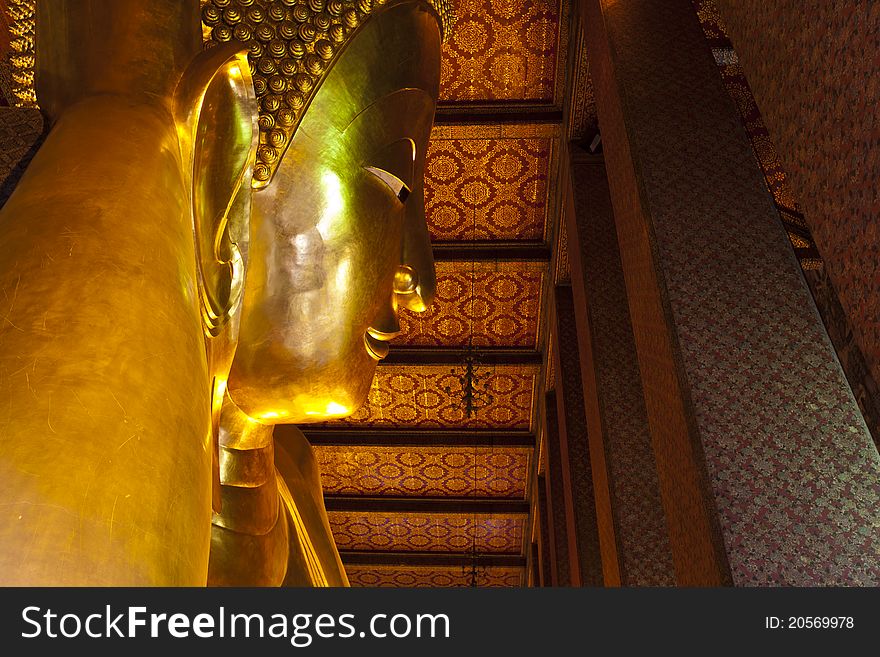 Reclining buddha within the Wat Pho in Bangkok.