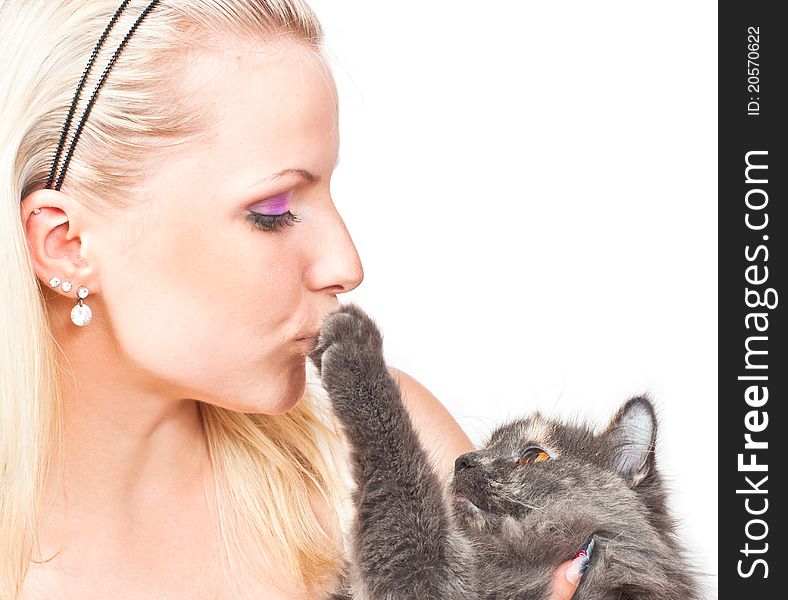 Beautiful young woman hugging and kissing cat. Beautiful young woman hugging and kissing cat