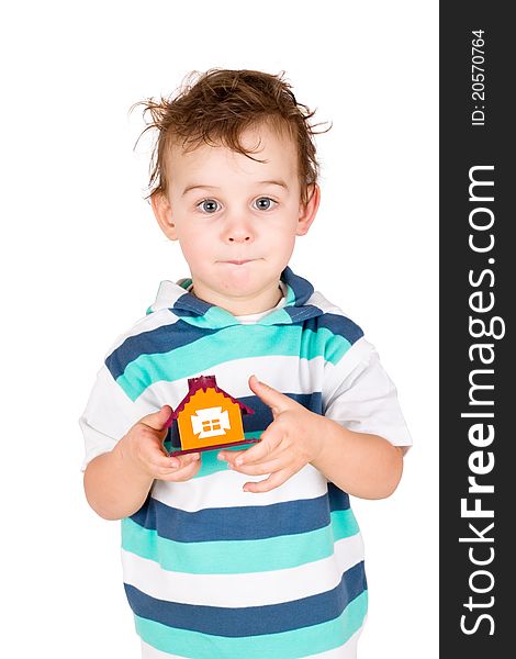 Little boy holding a toy house isolated on white