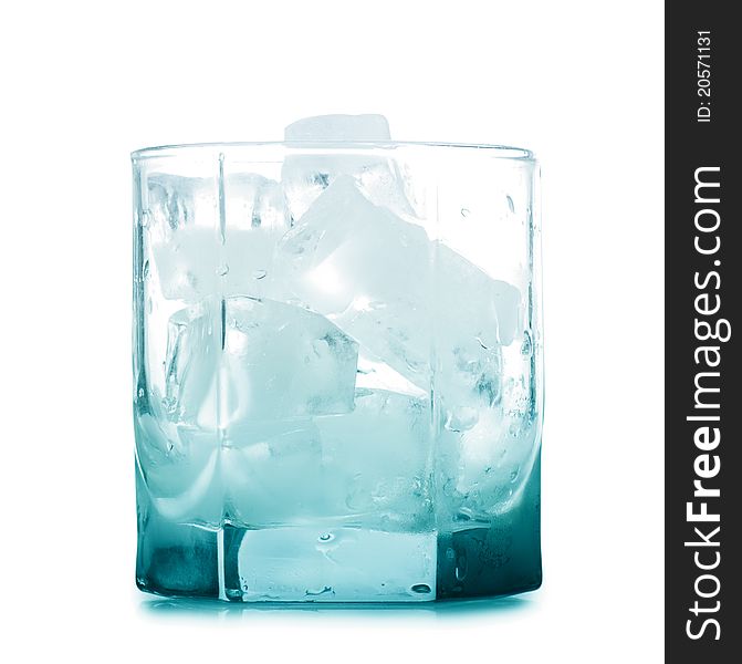 Empty glass with ice cubes over white background