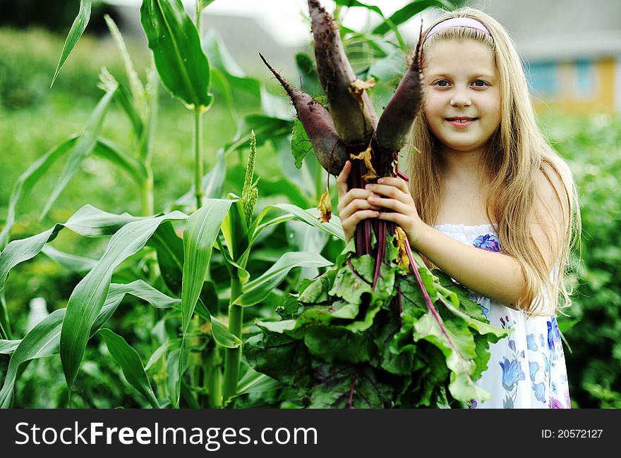 An image of a little girl with beetroots