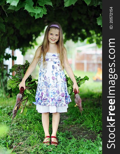 An image of a little girl with beetroots