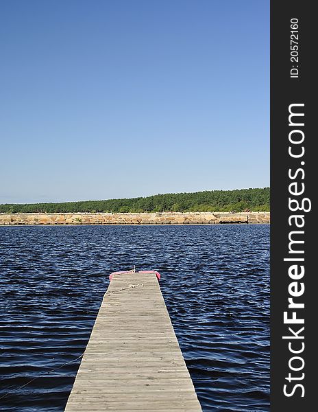 Empty pier against the sea