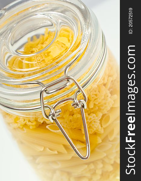 Pasta on glass bowl on a white background. Pasta on glass bowl on a white background