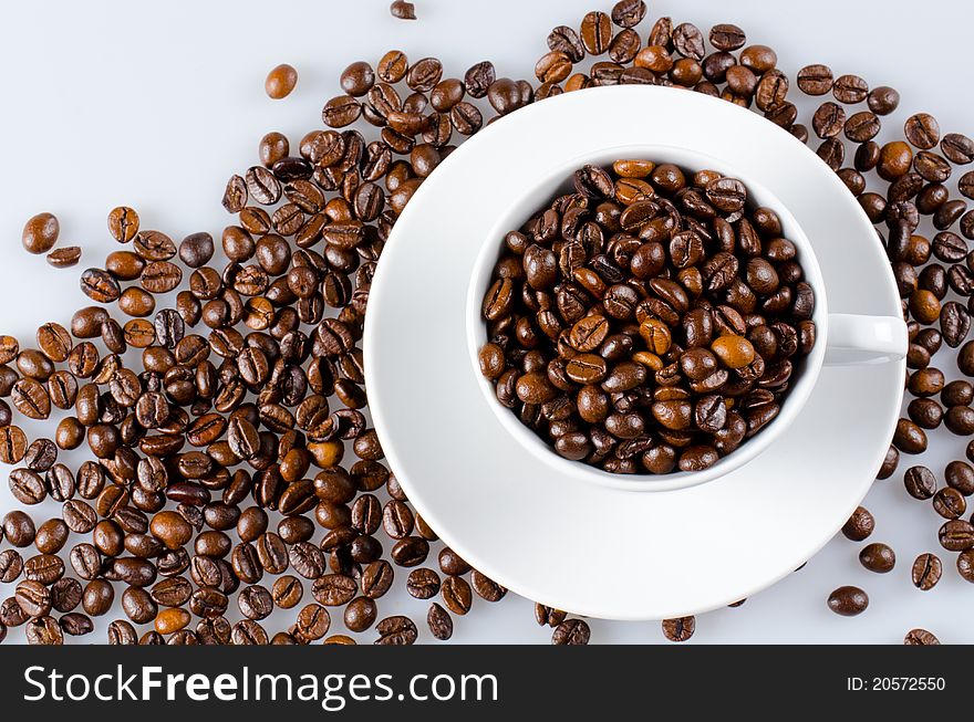 Cup of coffee full with coffee beans. Cup of coffee full with coffee beans