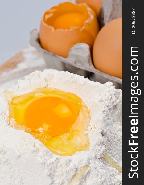 Detail of egg yolk on flour. Detail of egg yolk on flour