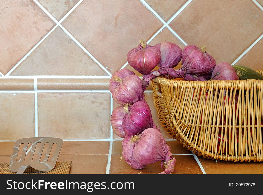 Onion in basket, and kitchen ware, shown as kitchen interior and home life. Onion in basket, and kitchen ware, shown as kitchen interior and home life.