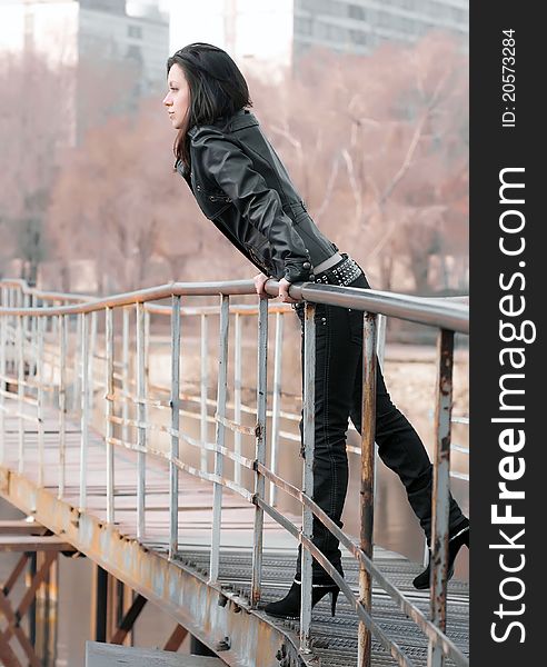 Girl on an iron bridge