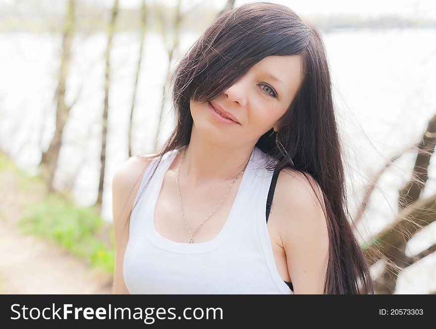 Young beautiful girl in a summer forest