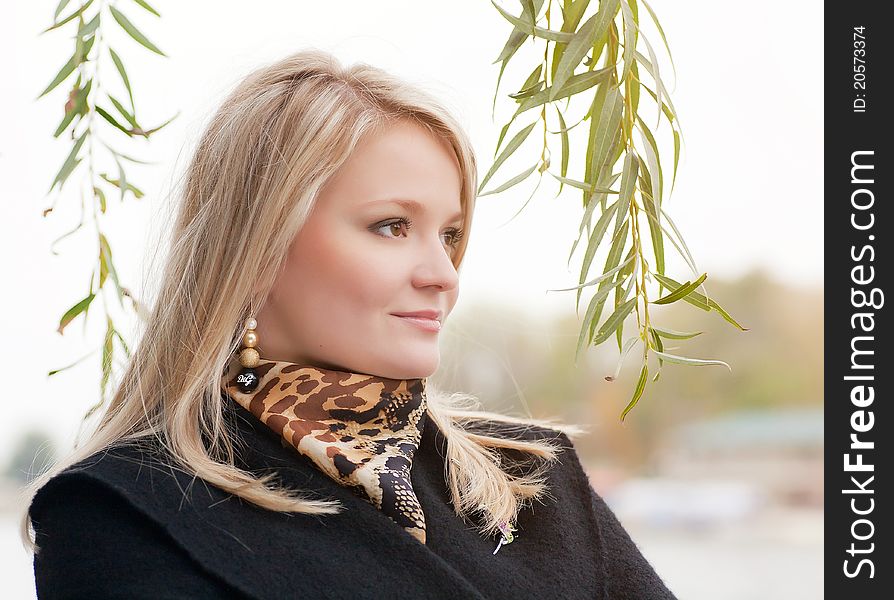 Autumn portrait of blonde girl