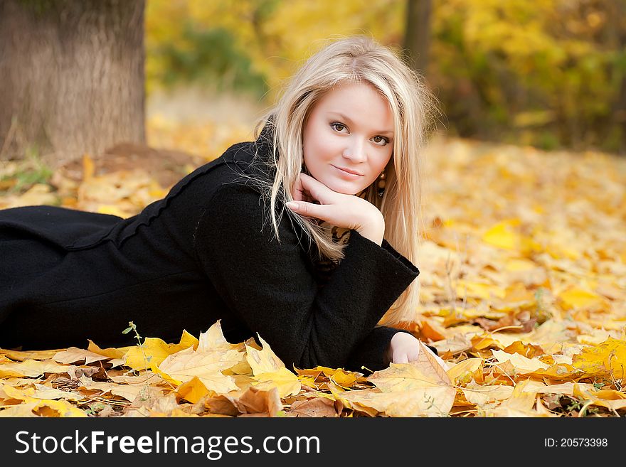 Autumn portrait of blonde girl