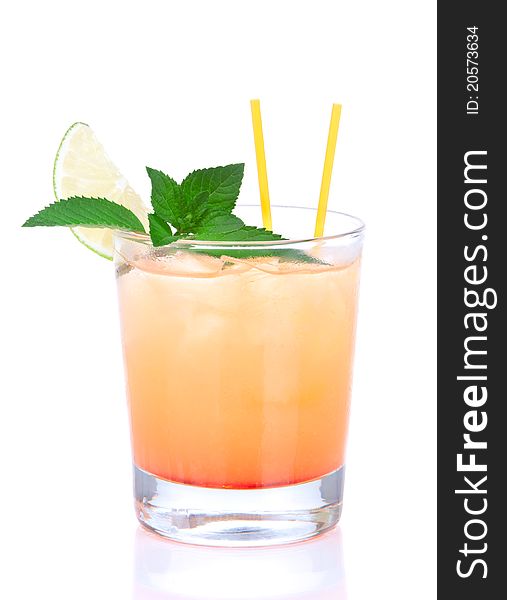 Alcohol tequila sunrise or margarita cocktail with crushed ice, green mint, yellow straws, lime in small glass isolated on white background. Alcohol tequila sunrise or margarita cocktail with crushed ice, green mint, yellow straws, lime in small glass isolated on white background