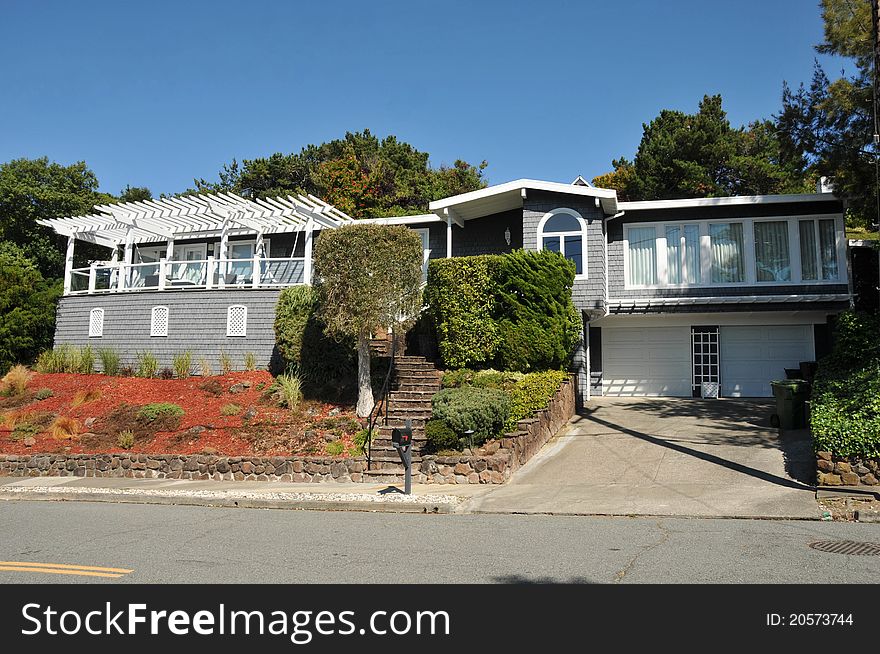 Single family house with two stories and a short driveway. Single family house with two stories and a short driveway