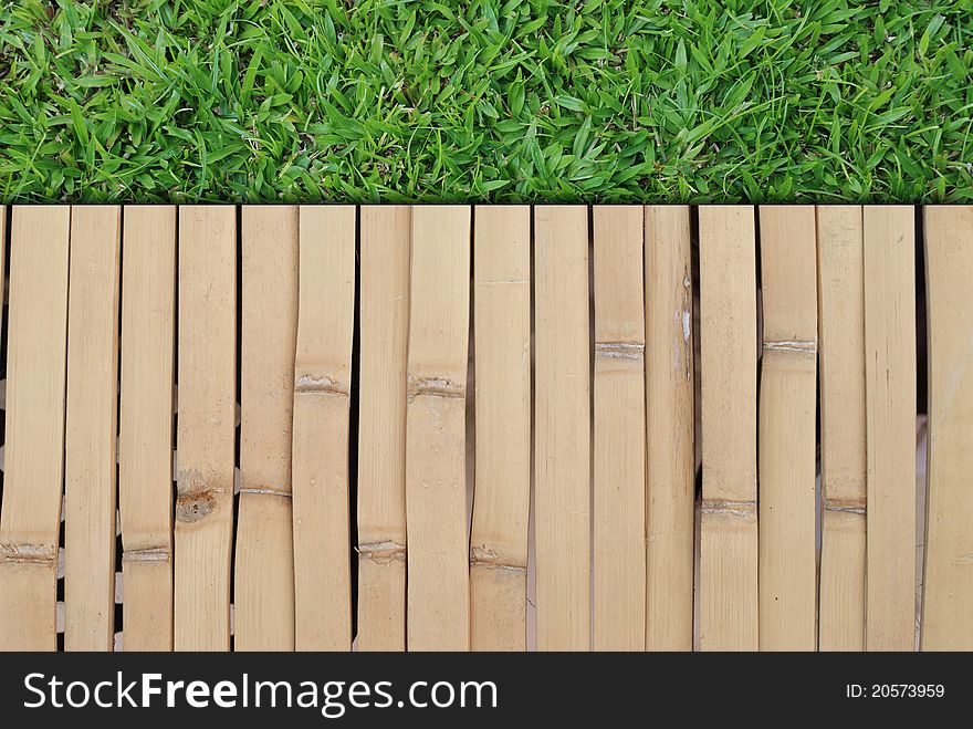 Grass field and wood wall background picture for general background usage.