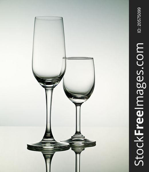 Two empty stemmed glasses for cocktail or wine